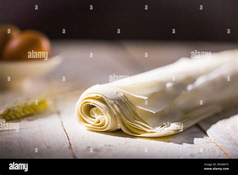 Filo pastry sheet on a wooden surface Stock Photo - Alamy