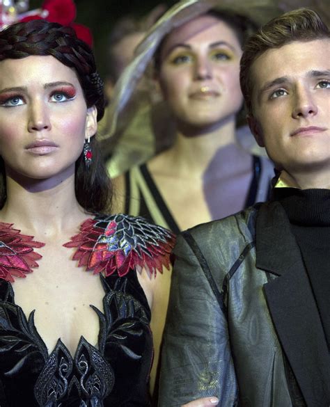 A Definitive Ranking Of "Catching Fire" Costumes
