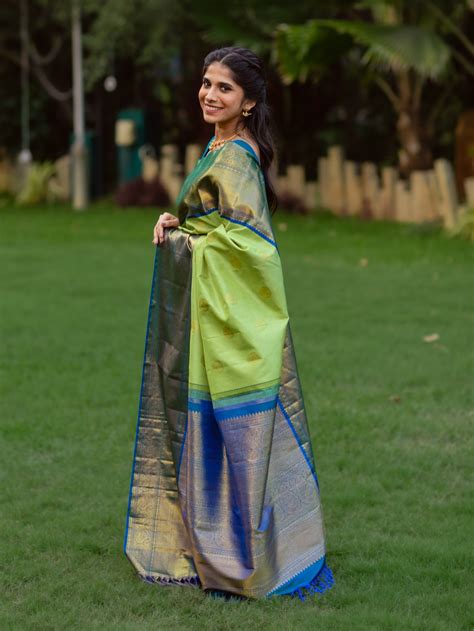 Light Green Kanjeevaram Silk Saree with Peacock Blue Border - Tulsi Weaves