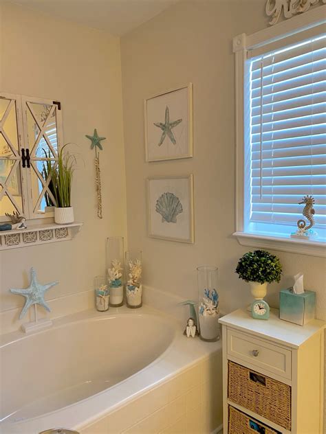 White Bathroom Decor with Sea Shell Window