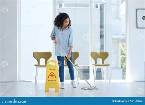 Once the Floors are Clean Im Satisfied. a Young Woman Mopping Her Floor ...