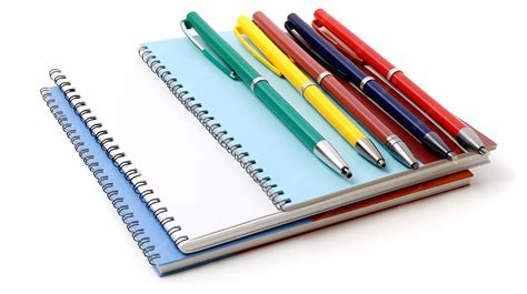 Premium Photo | Notebooks and pens a neat and academic display ...