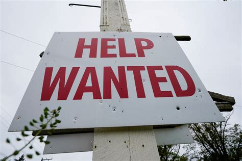 US applications for jobless benefits fall again as labor market continues to defy the Fed ...