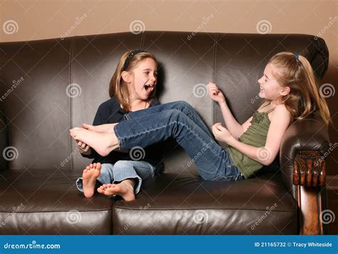Children tickling feet stock photo. Image of family, bonding - 21165732
