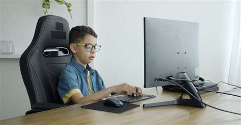 Boy Playing Computer Clip 的图像结果