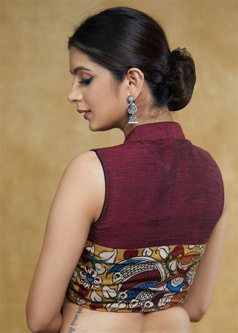 Graceful Maroon Mandarin Collar Sleeveless Blouse with Kalamkari Butto ...