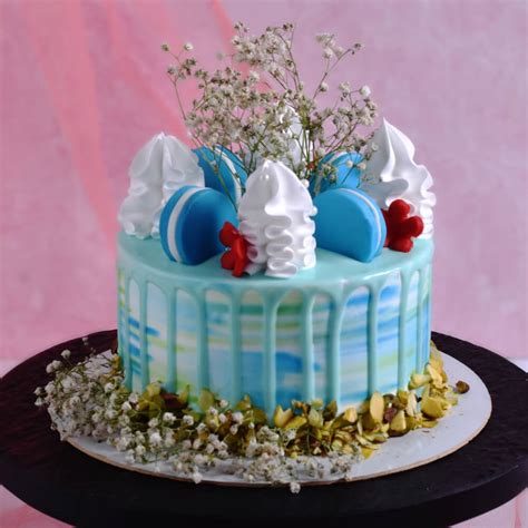 Indulge in Bliss: Blue Macaron Blossom Cake Magic Awaits