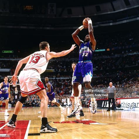Karl Malone of the Utah Jazz shoots a jump shot over Luc Longley of ...