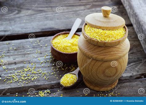 Raw Organic Polenta Corn Meal in a Wooden Bowl Stock Image - Image of ...