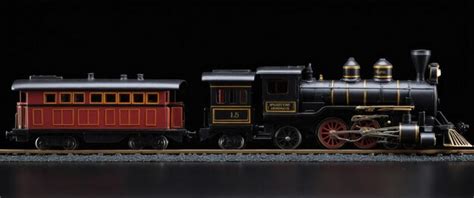 A detailed miniature steam train set on a black background perfect for ...