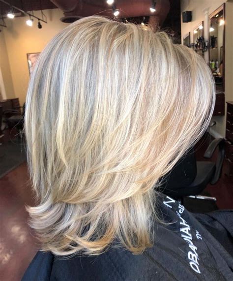 Above-The-Shoulder Feathered Blonde Haircut | Medium length hair cuts ...