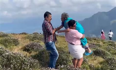 Sons Carry 87-Year-Old Mother On Shoulder To Fulfill Her Wish To ...