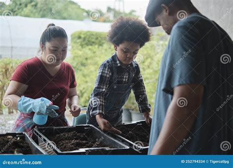 A Black Farmer Family Prepares Bio-fertilizer Together By Earthworm In The Soil Stock Photo ...