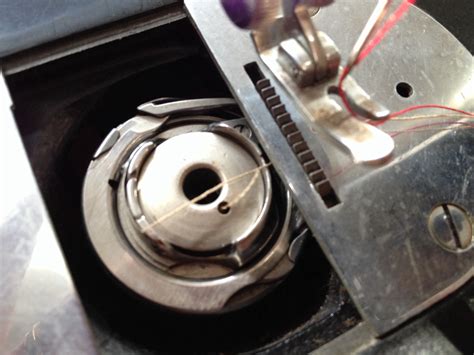 Image result for Threading Bobbin On Singer Simple