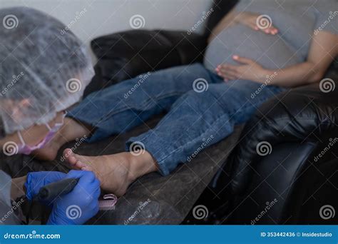 Pregnant Woman on a Hardware Pedicure Procedure in a Beauty Salon ...