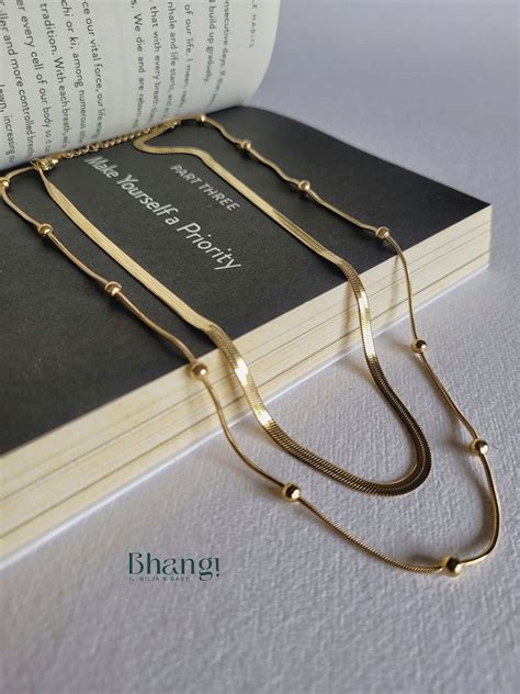 Layered Chain Necklace with Beaded Accents – Bhangi by Nilja K Baby