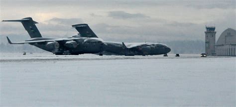 Temperatures are cooling down, JBLM's snow removal team heats up ...