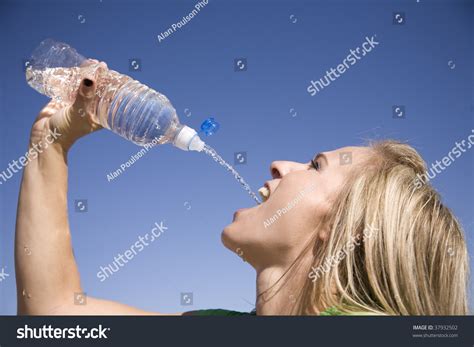 Woman Squirting Water Bottle Into Her Stock Photo 37932502 | Shutterstock