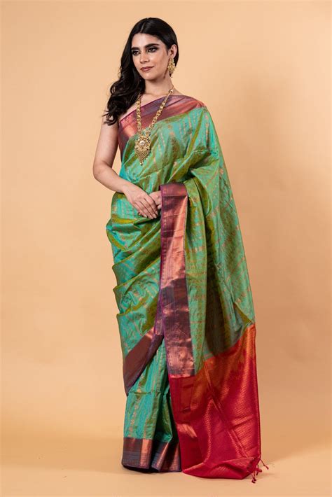 Buy Parrot Green Silk Saree with Copper Zari Woven Detailing | Anvi Couture