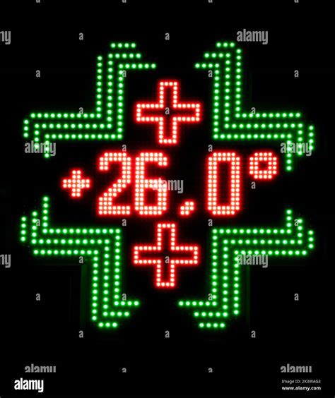 Pharmacy LED panel shows a temperature of 26 degrees celsius at night ...
