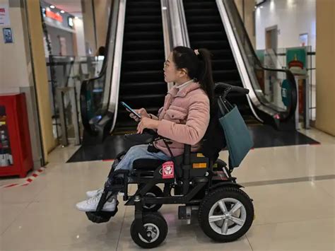 China wheelchair users dodge traffic on rough road to recognition ...