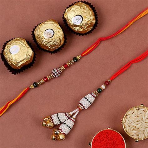 Send White Pearl Bhaiya Bhabhi Rakhi And 3 Pcs Ferrero Rocher Online