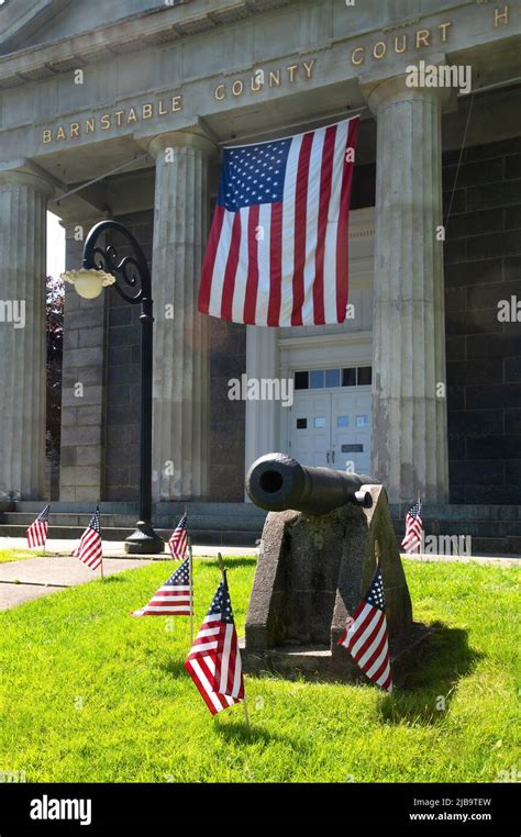 A cannon decorated for Memorial Day in front of the Barnstable County ...