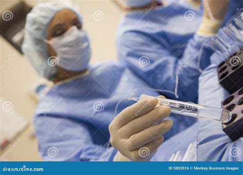 Nurse Assisting with Egg Retrieval Procedure Stock Photo - Image of male, colour: 5003916