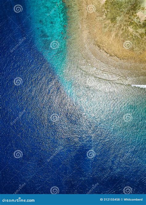 Top Down Aerial View of Blue Water and a Tropical Coral Reef in a Warm ...