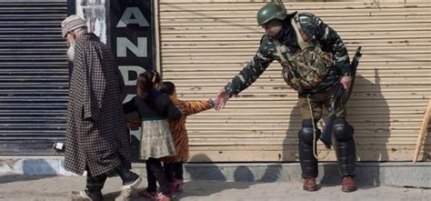 Photo Of CRPF Soldier Kashmiri Kid Sharing A Sweet Moment Radiates Hope ...