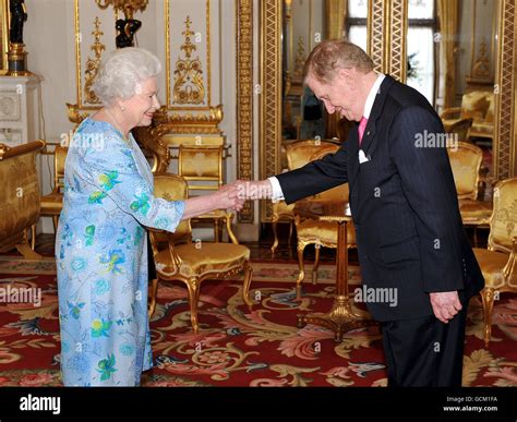 The Queen shakes hands with the Hon Michael Kirby of Australia, during ...
