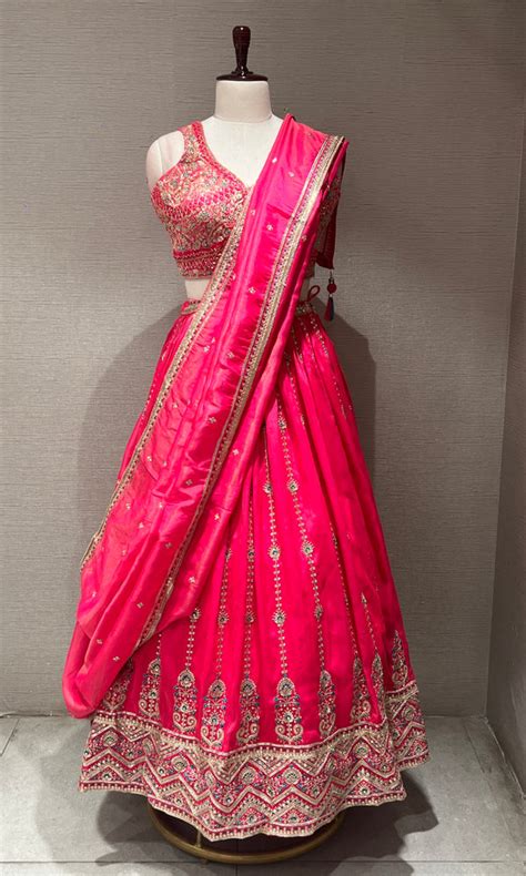 rani pink lehenga with intricate embroidery