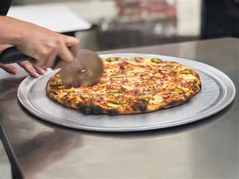 Image result for Someone Using Pizza Cutter