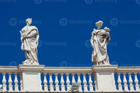 Detail of the statues of saints that crown the colonnades of St. Peter Square built on 1667 on ...