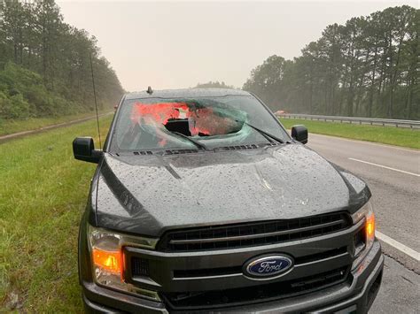 Florida lightning strike blasts chunk of roadway into vehicle - The ...