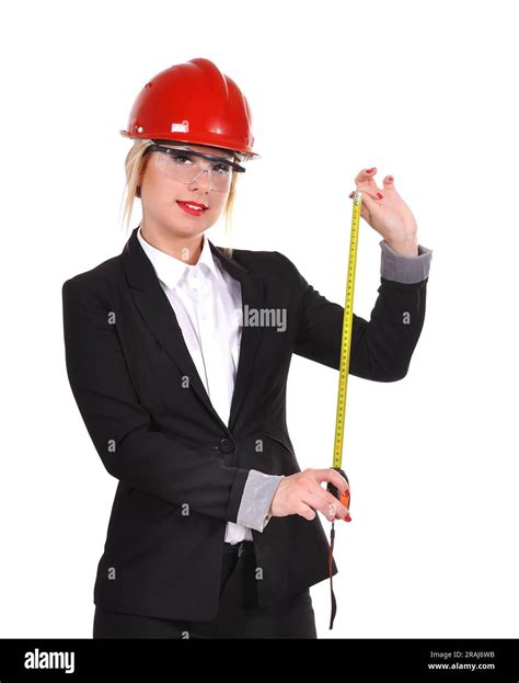 Engineer woman holding tape measure in hand Stock Photo - Alamy