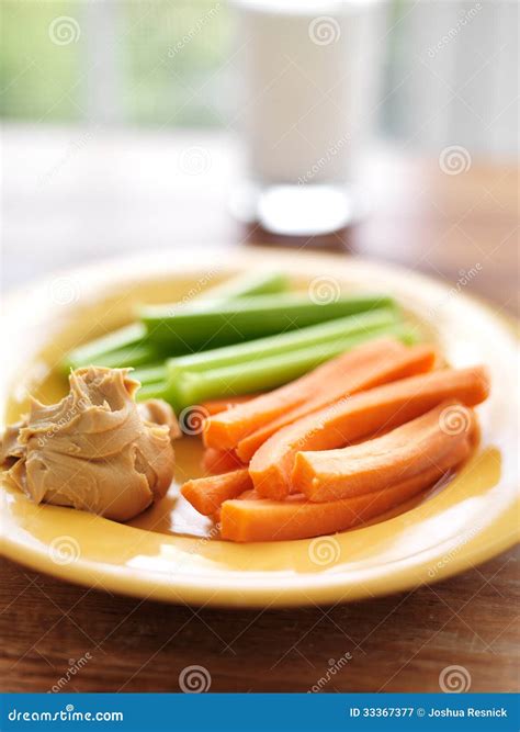 Kids Food - Peanut Butter with Celery and Carrots. Stock Image - Image ...