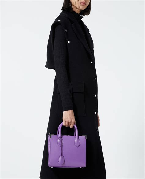 Long black wool coat with press studs | The Kooples