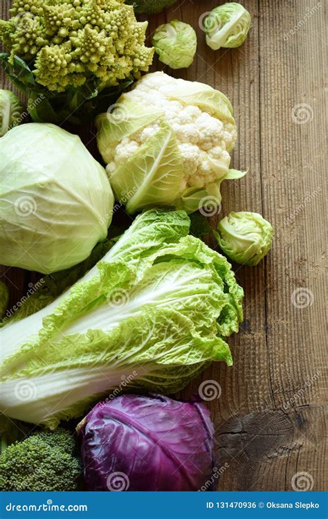 Different Varieties of Cabbages on Wooden Background. Organic Fresh ...
