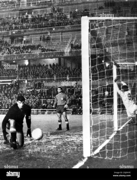 England centre forward Joe Baker (left) scores the first English goal ...