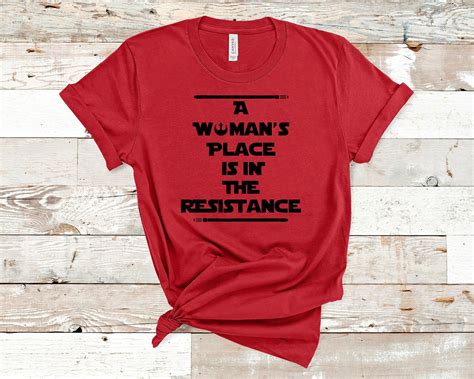 Premium Shirt A Woman's Place is in the Resistance Tshirt 3001 Bella ...