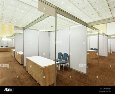 Trade show interior with booth and tables Stock Photo - Alamy