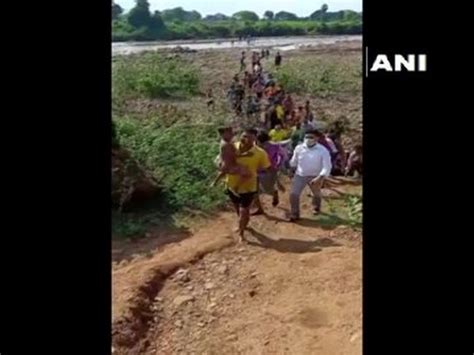 Odisha fire personnel rescue child trapped between two rocks in river