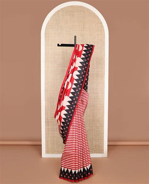 Red with white polka dot printed silk saree with contrast geometric de