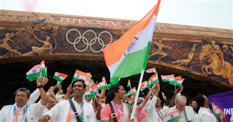 PIX: Flag bearers Sindhu, Kamal lead India in floating parade - Rediff ...