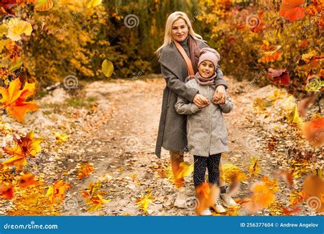 Happy Family on Autumn Walk Mother and Daughter Walking in the Park and ...