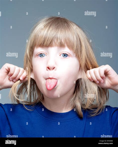 Boy sticking tongue out hi-res stock photography and images - Alamy