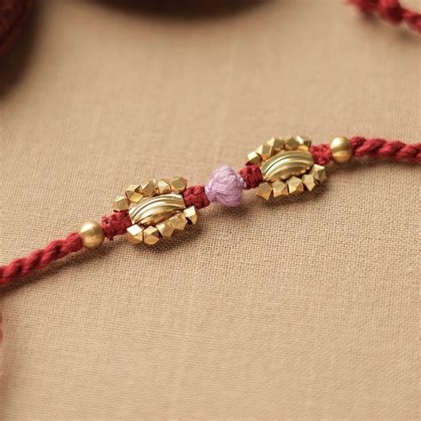 Tribal Dokra Craft Brass & Threadwork Rakhi 15 Online at iTokri.com