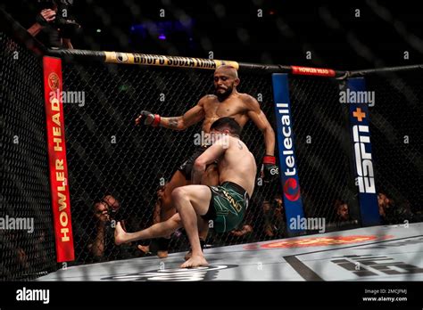 Mexico's Brandon Moreno, bottom, competes with Brazil's Deiveson ...