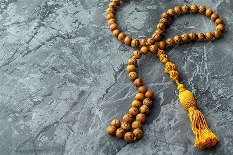 Premium Photo | Muslim prayer beads and space for text on grey background